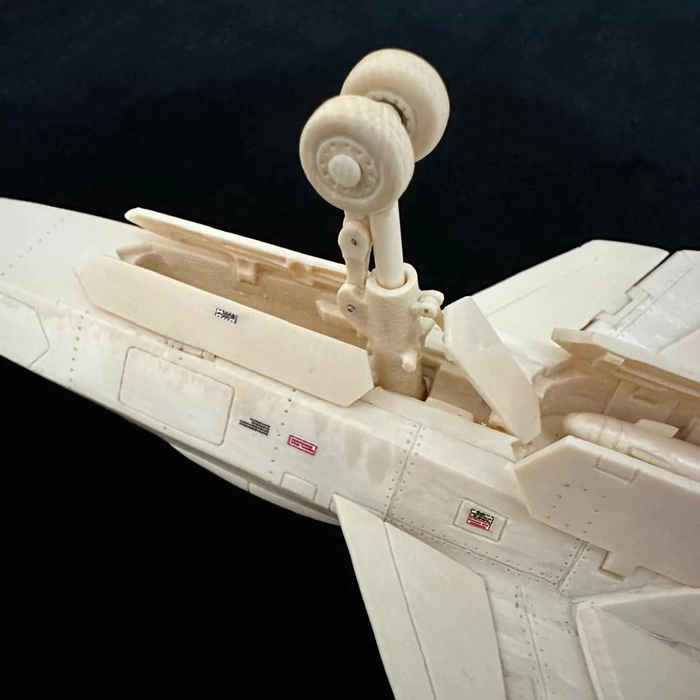 A composite model of the SU-57 mammoth tusk aircraft on a stand